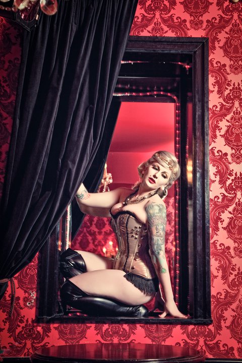 Female model photo shoot of Terra Kenzie by Sly Pereira in Cherry Cola's Rock N' Rolla Cabaret and Lounge. Toronto,ON, clothing designed by Sweet Carousel Corsetry
