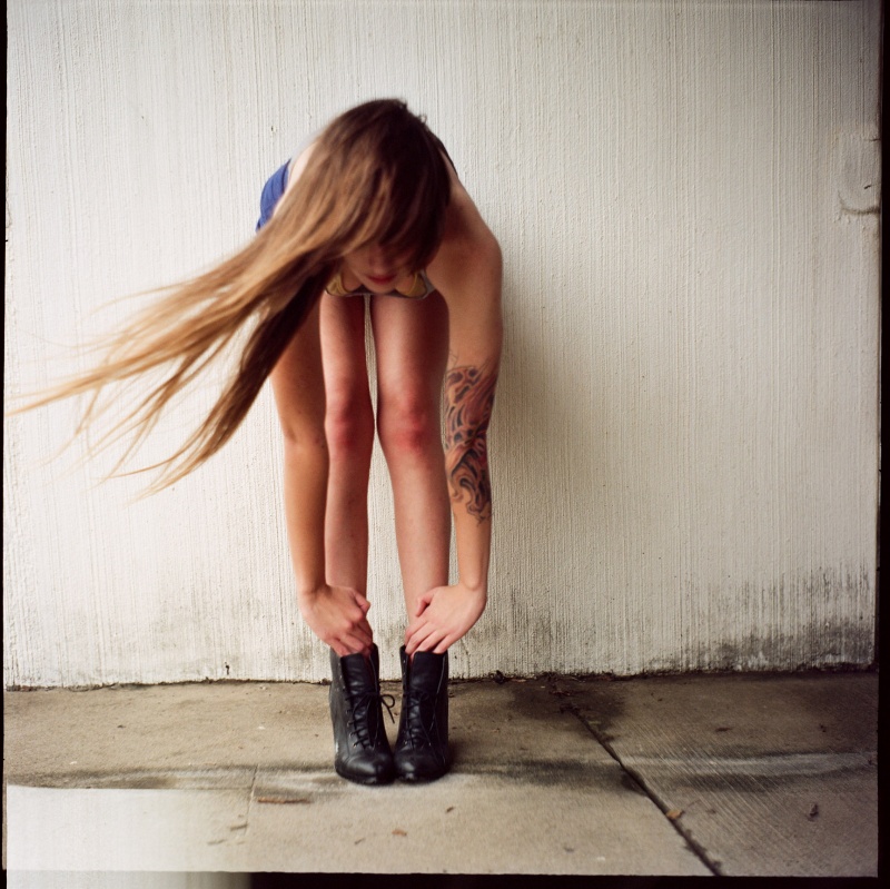 Female model photo shoot of rachel  a w by Chris Fitzgerald in concrete field