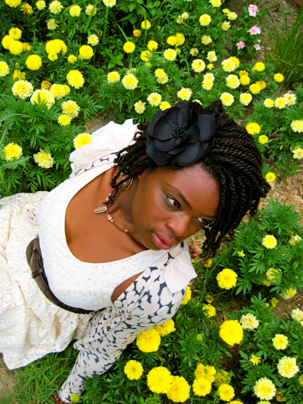 Female model photo shoot of Aziza  in Field of flowers