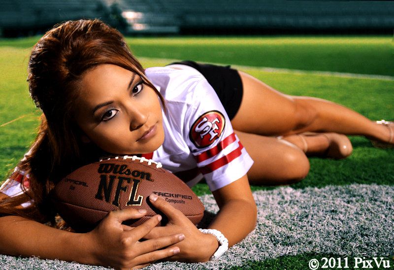 Female model photo shoot of Pauline N by PixVu Photography in Football Field