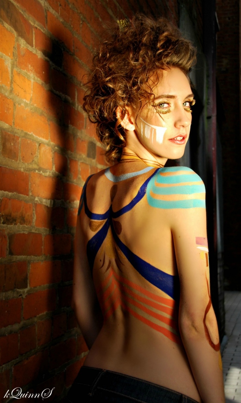 Female model photo shoot of Katie Quinn Sullivan in Gastown tattoo parlor