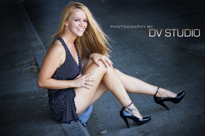 Female model photo shoot of Super Shea by DV STUDIO in under a freeway bridge in Hwood
