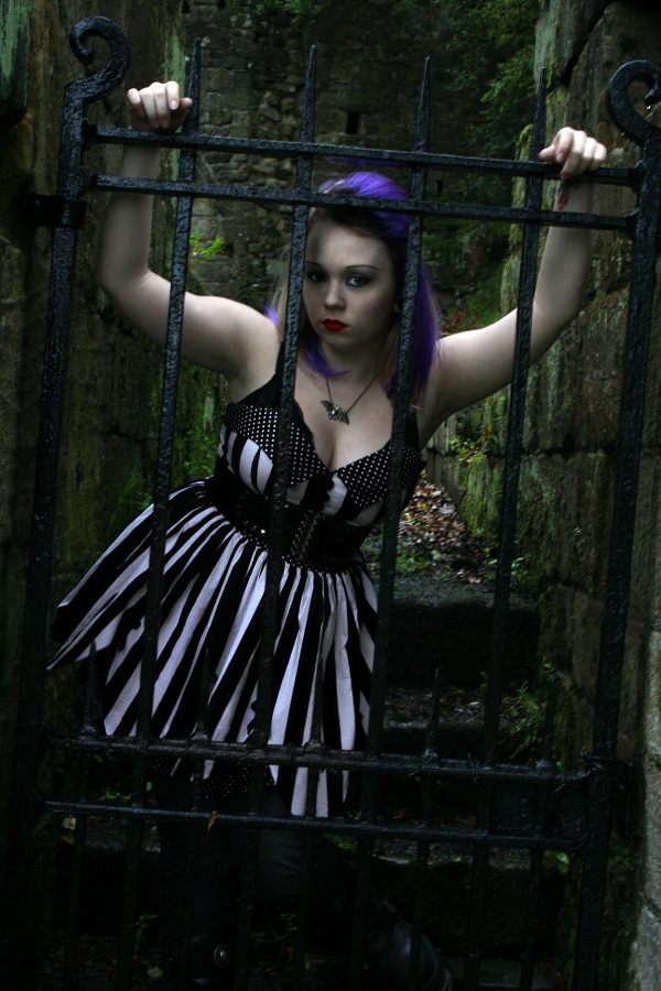 Female model photo shoot of Scarlet Designs in Dunfermline Abbey