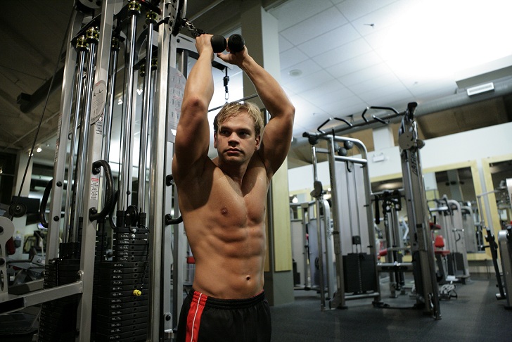 Male model photo shoot of Oskar Moller in Gym