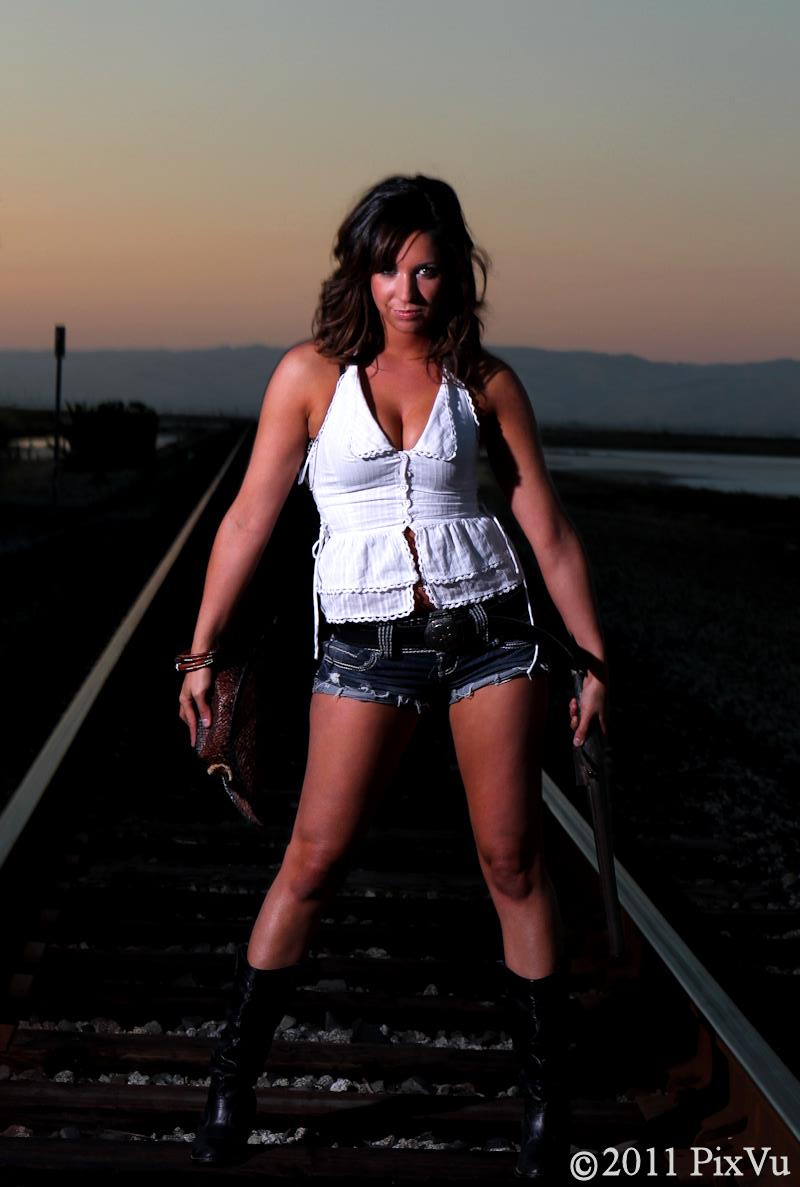 Female model photo shoot of Allison T by PixVu Photography in Railroad Tracks