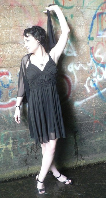 Female model photo shoot of Shannon Ashmen in Under an old railroad bridge in AL.