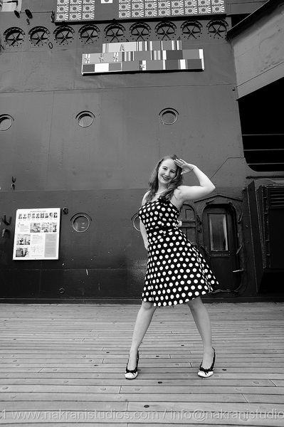Female model photo shoot of Kari Sanderlin by Nakrani Studios in USS North Carolina, makeup by Contessa Black