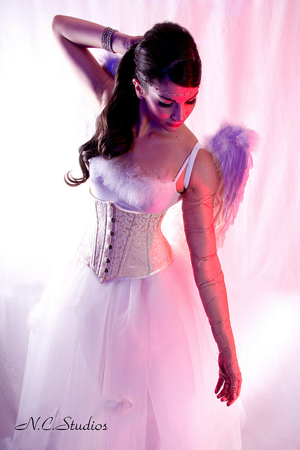 Female model photo shoot of Mariana T, makeup by Make up girl Kamni, clothing designed by Serinde Corsets