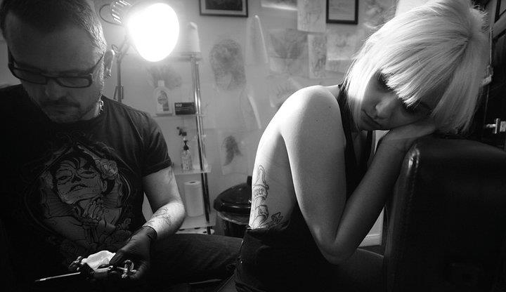 Female model photo shoot of steffiburg in joker tattoo studio