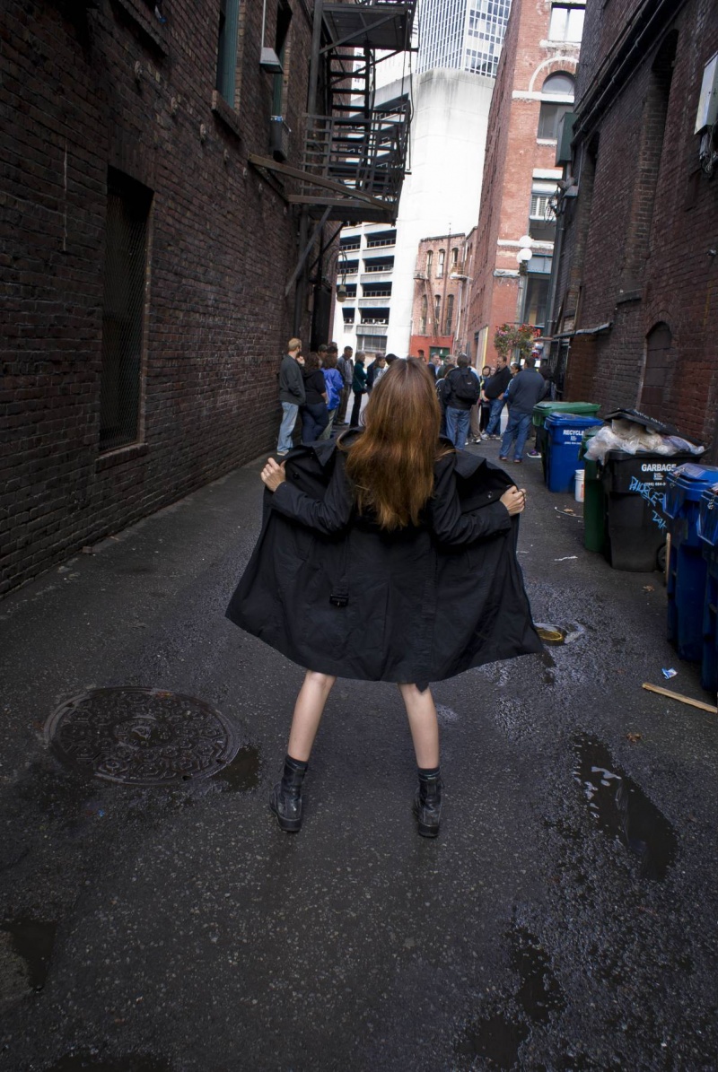 Female model photo shoot of Artemis Bare by Visualtaffy in Seattle. Right in front of a city tour