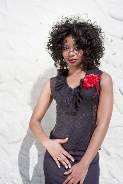 Female model photo shoot of RudeElegance in Ybor City, Tampa, hair styled by Kanisha Mallea
