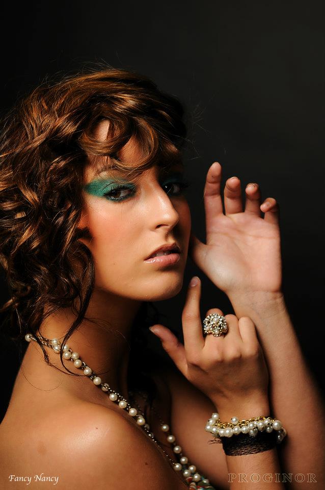 Female model photo shoot of fancy makeup  in studiolenoir