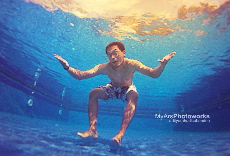 Male model photo shoot of adityo in pool