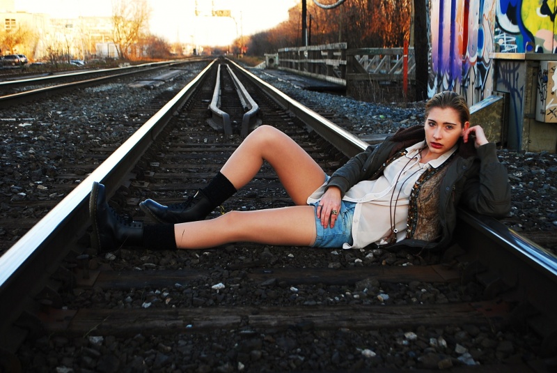Female model photo shoot of Marina Chekalova in Dupont train-tracks