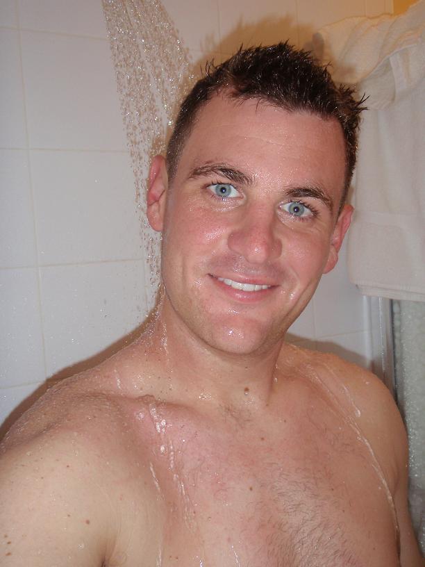 Male model photo shoot of sports guy in shower