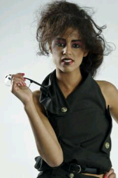 Female model photo shoot of Larissa x, clothing designed by Caroline Baldry
