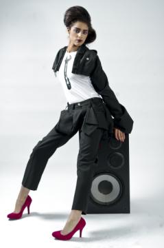 Female model photo shoot of Larissa x, clothing designed by Caroline Baldry