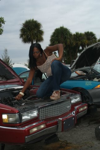 Female model photo shoot of Haitian Queen by Larry Quick in Junk Yard
