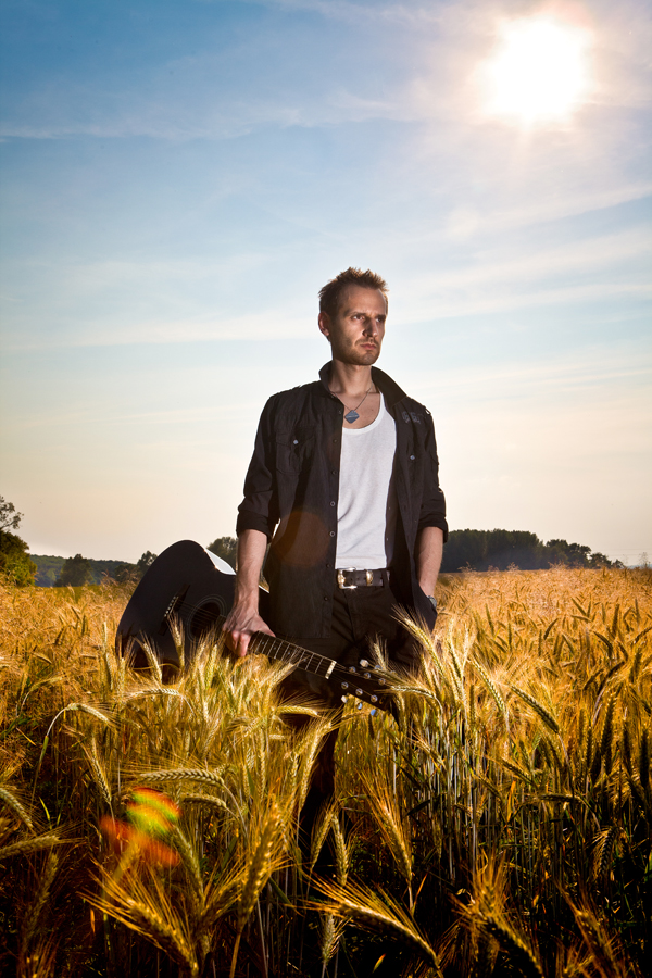 Male model photo shoot of Imre Csokonyi in field
