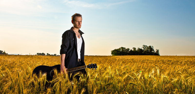 Male model photo shoot of Imre Csokonyi in field