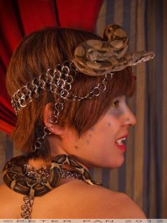 Female model photo shoot of Ashes make up and snake and Kai Weevil, art by The Jack of All Trades and Studio Paradiso