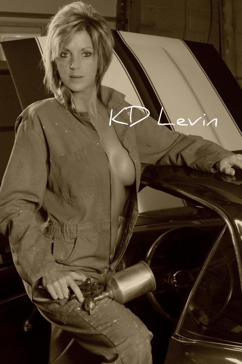 Female model photo shoot of KD Levin by Gallus Studio in Auto Shop