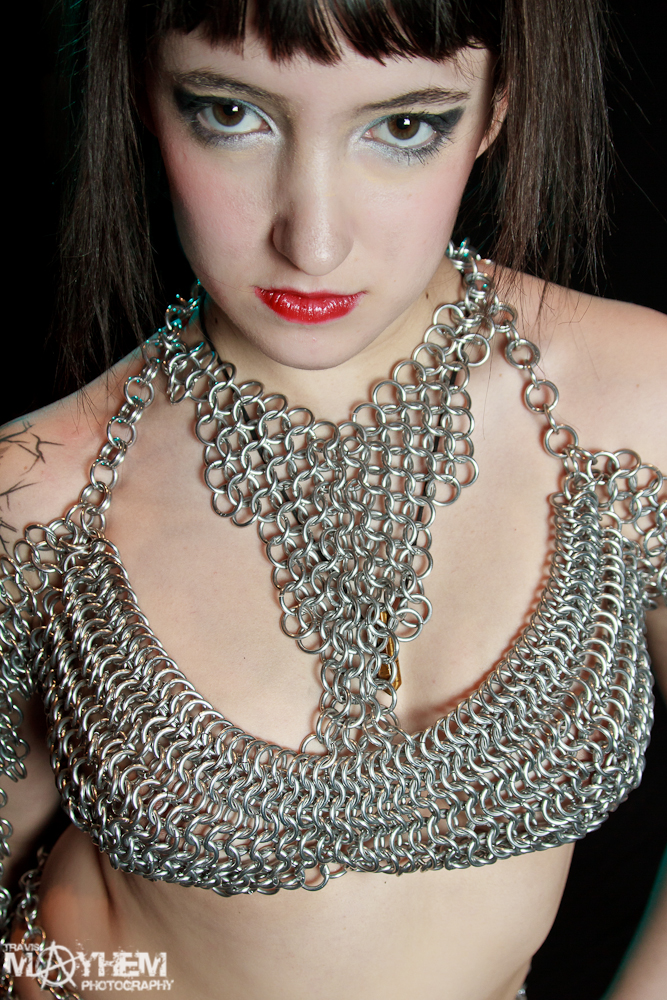 Female model photo shoot of Faye Fully Loaded in fetish flair fashion show 2012, clothing designed by Pendragon Chainmail
