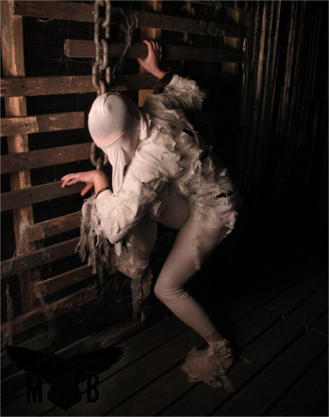 Female model photo shoot of Madame Black Photograph and Sparks in A spooky place in DC
