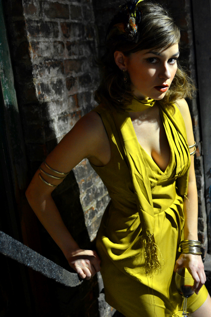 Female model photo shoot of Jeannette Trexler in On fire escape in alley (brooklyn)