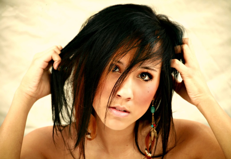 Female model photo shoot of Brittany Mai Nguyen by PhotoshootGuy in In studio