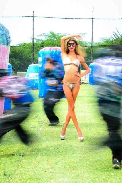 Female model photo shoot of Marylain Veldman in aruba, paintball field