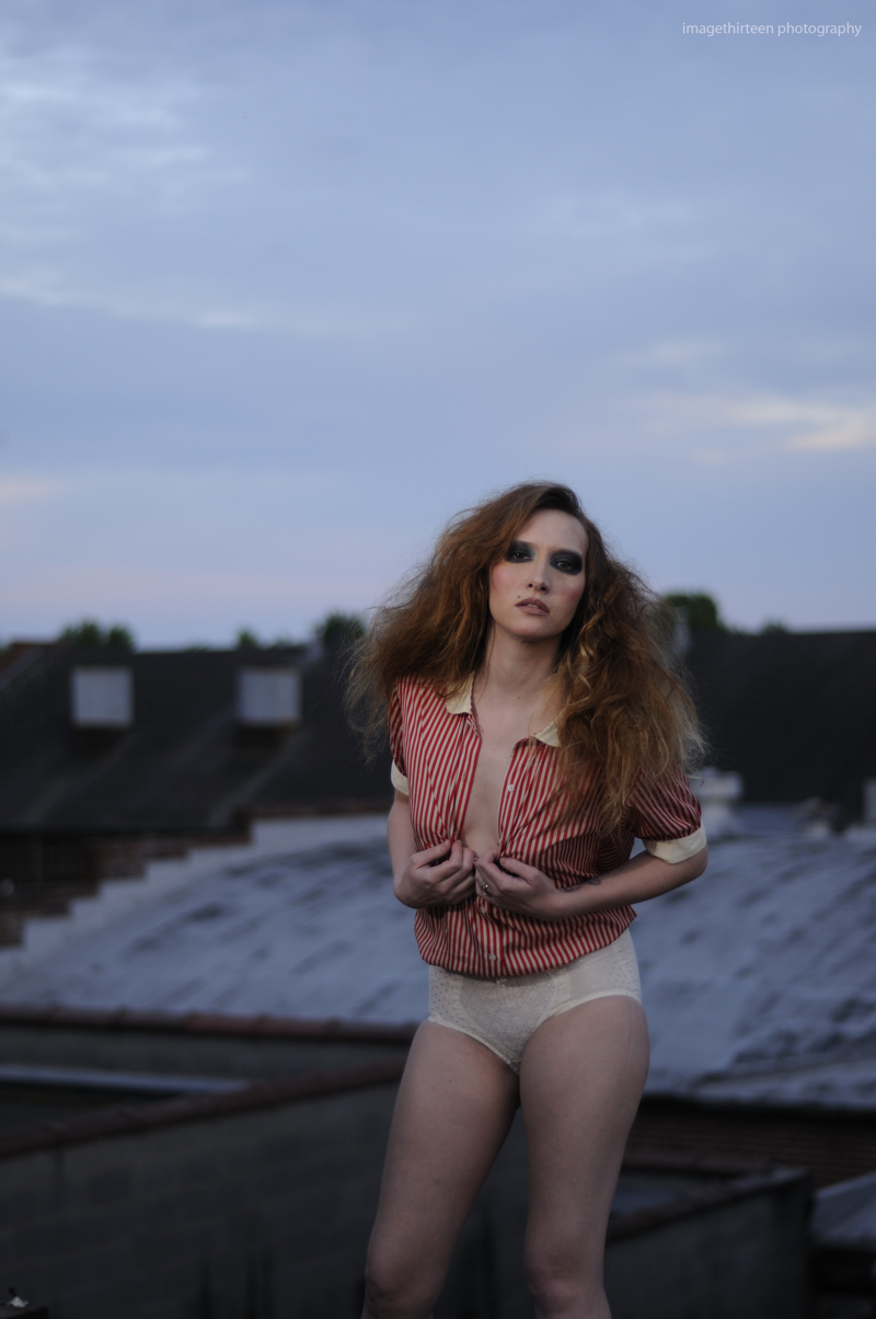 Female model photo shoot of Nicolette K by imagethirteen  in on a roof, makeup by Lex Ewing