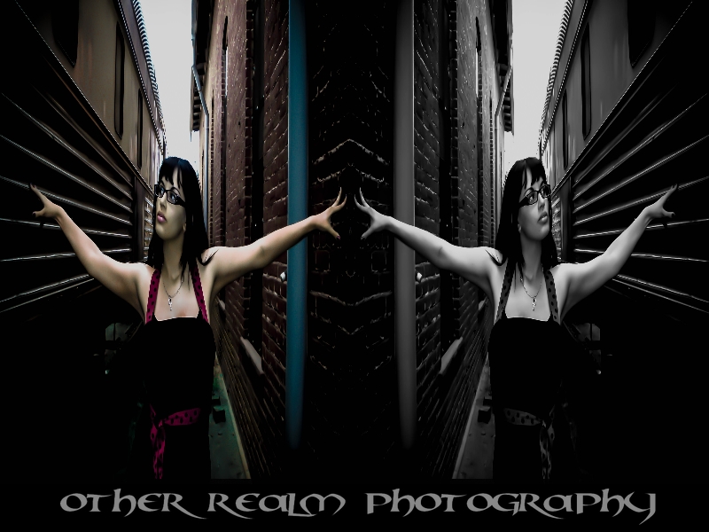 Female model photo shoot of Other Realm Photography in Alley