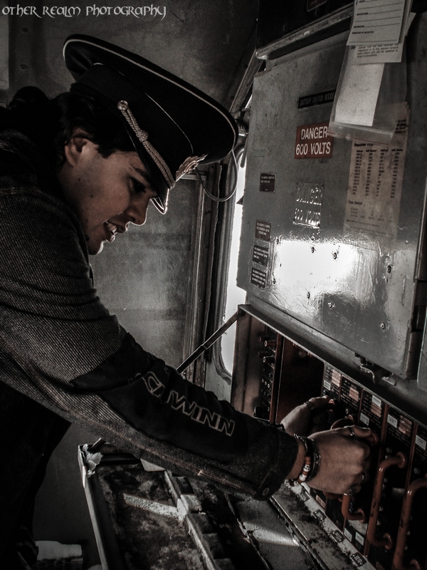 Female model photo shoot of Other Realm Photography in Abandoned Trains