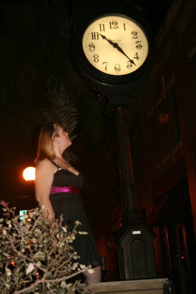 Female model photo shoot of Kotton Kandii in Under the clock in Downtown Valdosta