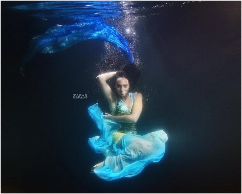 Female model photo shoot of Roksy in water