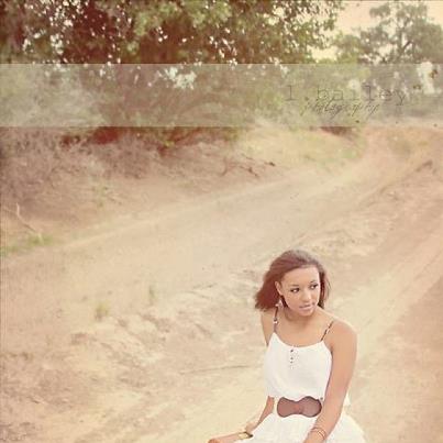 Female model photo shoot of Courtney Jamaye in dirt road