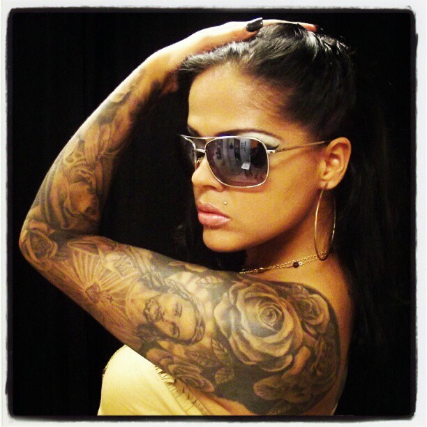 Female model photo shoot of FANCY  in The Lion's Den Tattoos