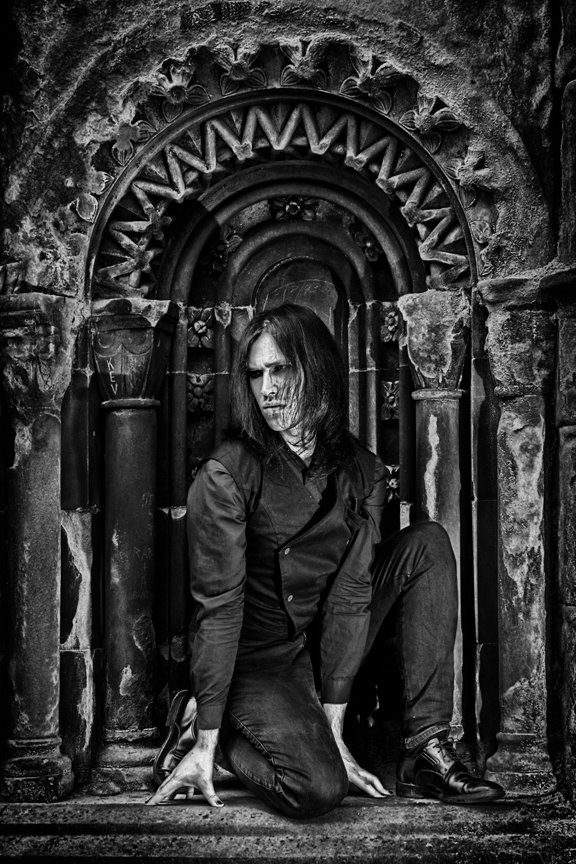 Male model photo shoot of Xander Noir in Glasgow Necropolis