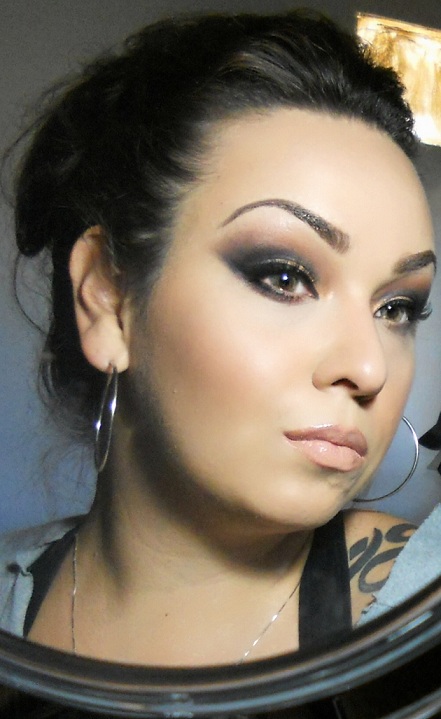 Female model photo shoot of  Makeup by Jezikahh
