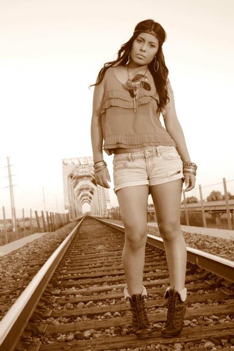 Female model photo shoot of Michelle Aguila in traintracks