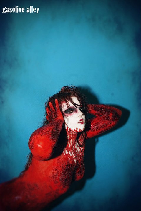 Female model photo shoot of Red Herring by Arsenic Addiction, makeup by 3BArtistry