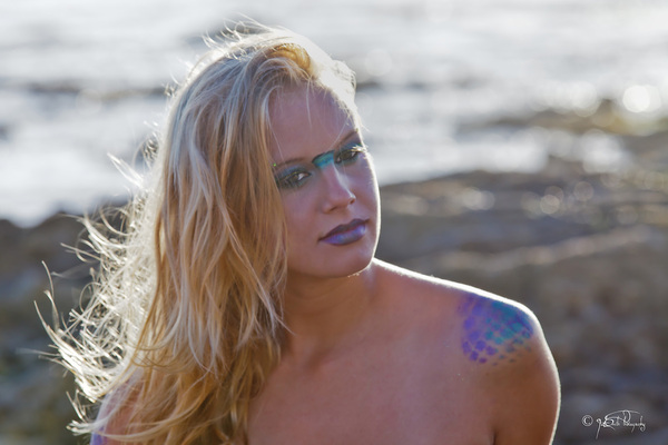 Female model photo shoot of Struck By Color Makeup in crystal cove, laguna beach