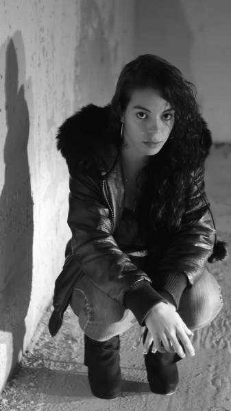 Female model photo shoot of Ally Lovely in underground parking lot, hamilton ontario