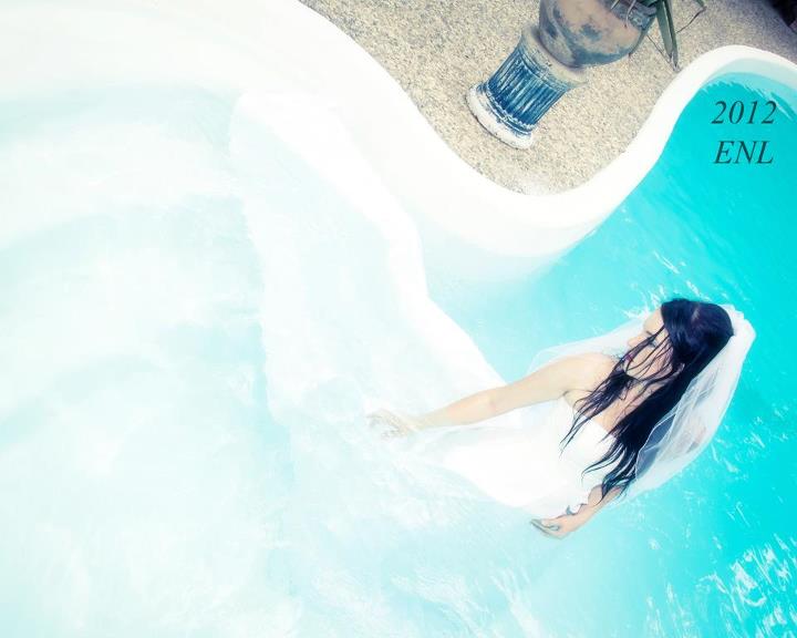 Female model photo shoot of ASHLEY E HOPE in Pool