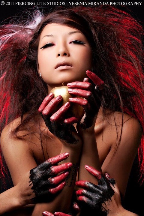 Female model photo shoot of World of Hair By Misa in Piercing light studio