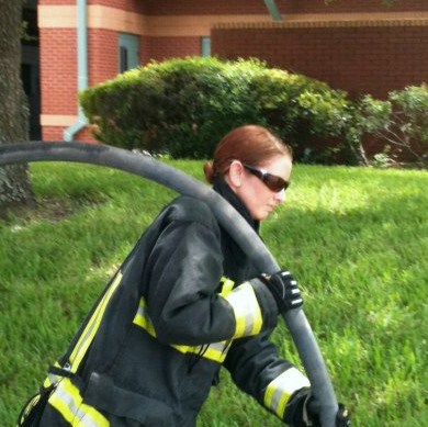 Female model photo shoot of Erin Hurley in St. Petersburg Fire Rescue Station 3