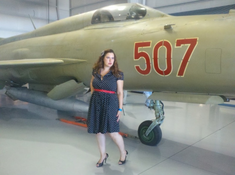 Female model photo shoot of Victory Rose in Confederate Airforce Museum