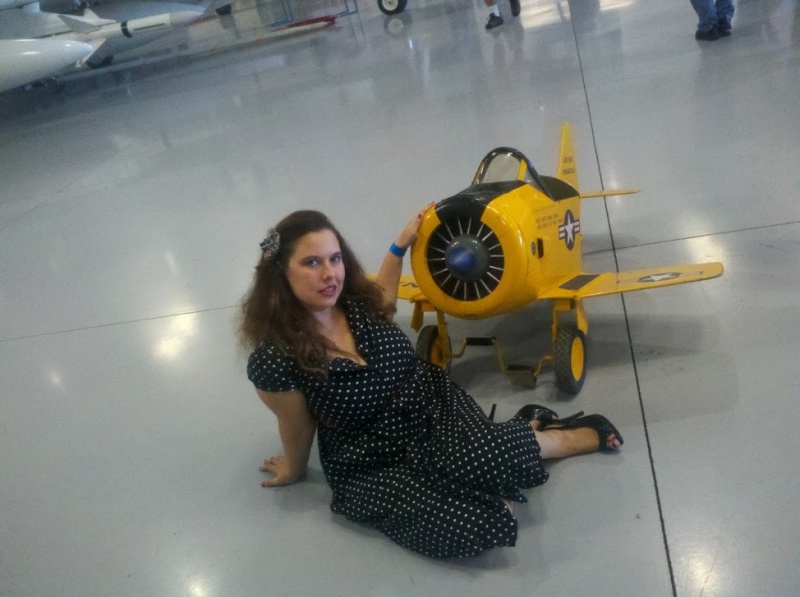 Female model photo shoot of Victory Rose in Confederate Airforce Museum