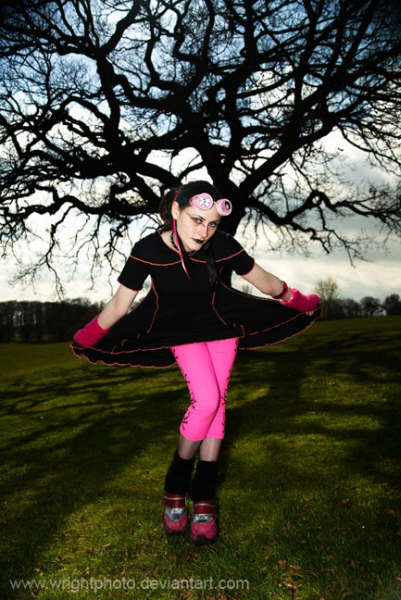 Female model photo shoot of Twisted Pixie Clothing and Violet Magenta